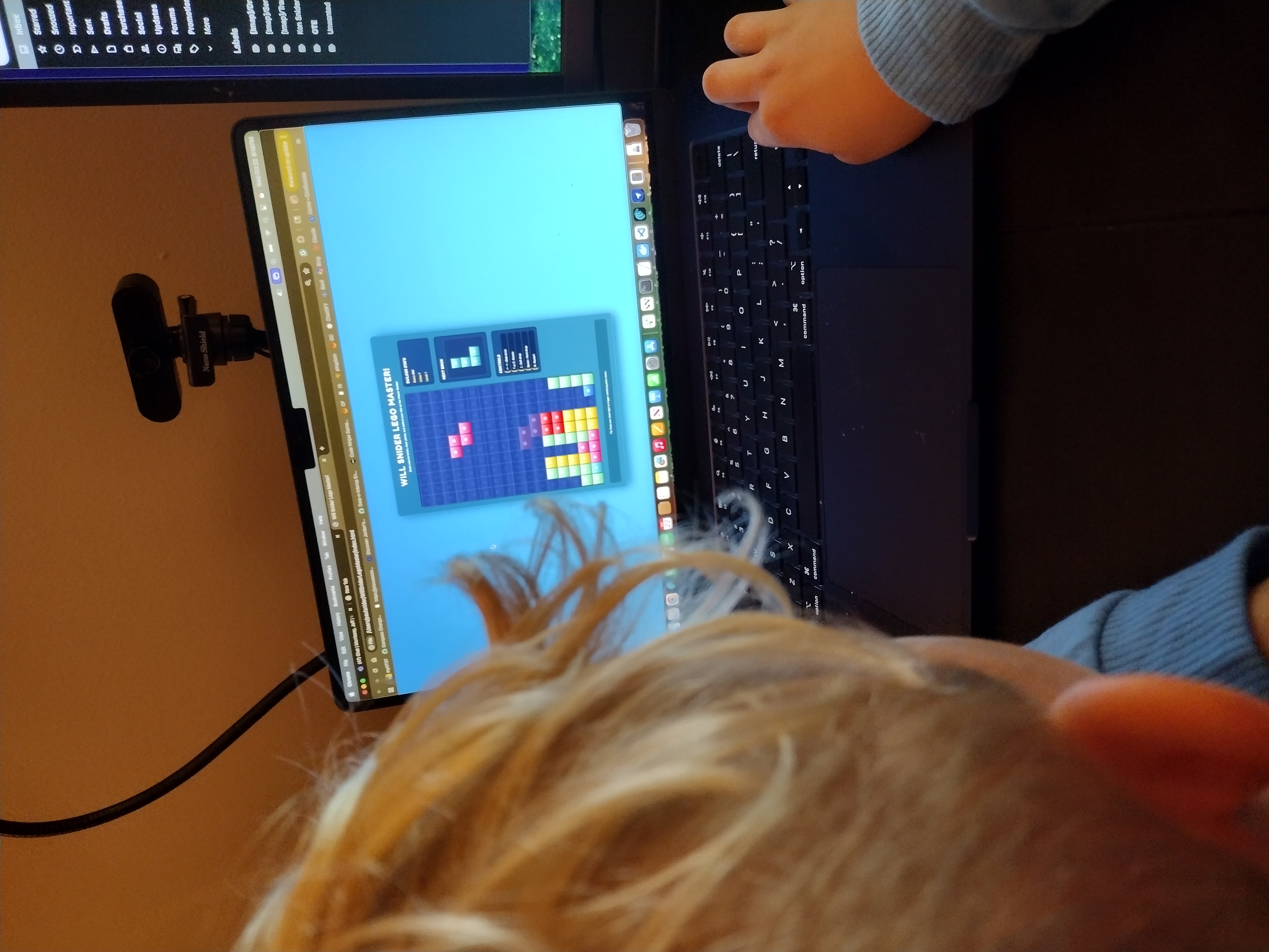 Paul and Will testing Lego Master on a laptop